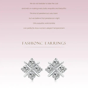 Pair of diamond earrings on a pink background with text