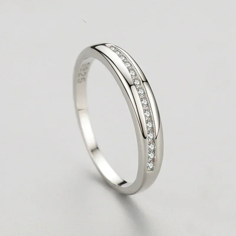 925 silver ring with channel-set cubic zirconia on plain white background