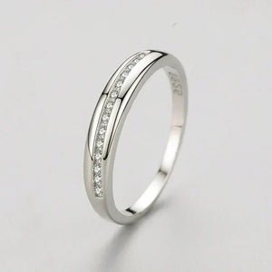 925 silver ring with channel-set cubic zirconia on plain white background