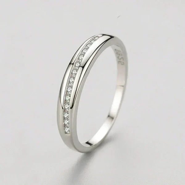 925 silver ring with channel-set cubic zirconia on plain white background
