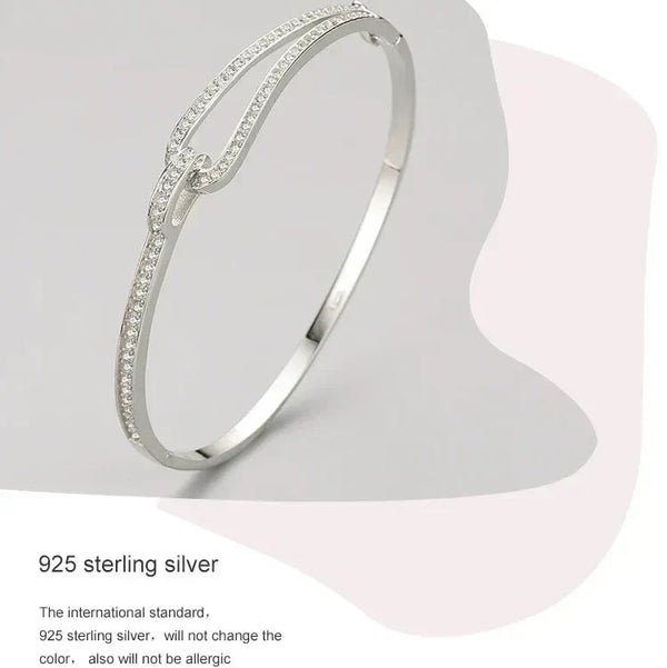 Silver bracelet on a light gray background with text about 925 sterling silver-Crystal Maze Sterling Bracelet - TM & CO. JEWELS .