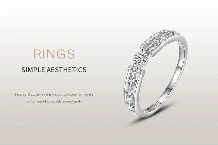 925 silver ring with central round gemstone and star accents, elegant minimalist jewelry design