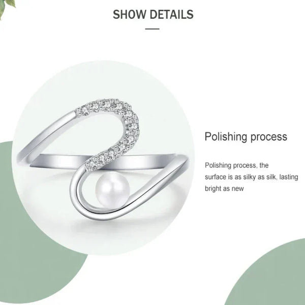 Silver ring with a pearl on a white background, highlighting the polishing process.