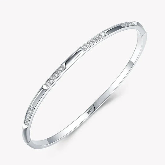 925 silver bangle bracelet with cubic zirconia accents on a white background