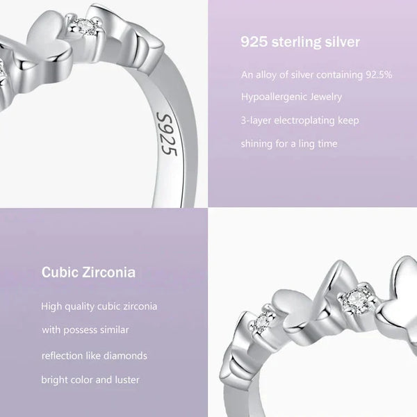 Silver ring with cubic zirconia on a light purple background, featuring product details.