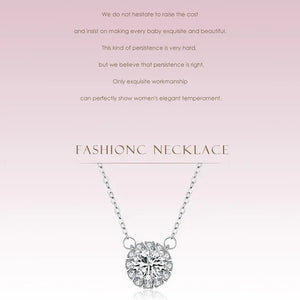 Silver necklace with a diamond pendant on a light gray background.