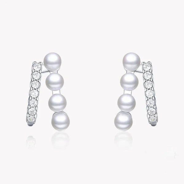 Sterling silver earrings with vertical white pearls and sparkling cubic zirconia accents