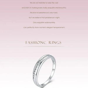 Silver ring with diamonds on a light pink background with text about fashion rings.