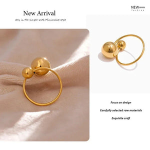  18K gold-plated ring with two polished sphere accents on white background- TM & CO. JEWELS 
