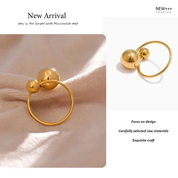  18K gold-plated ring with two polished sphere accents on white background- TM & CO. JEWELS 