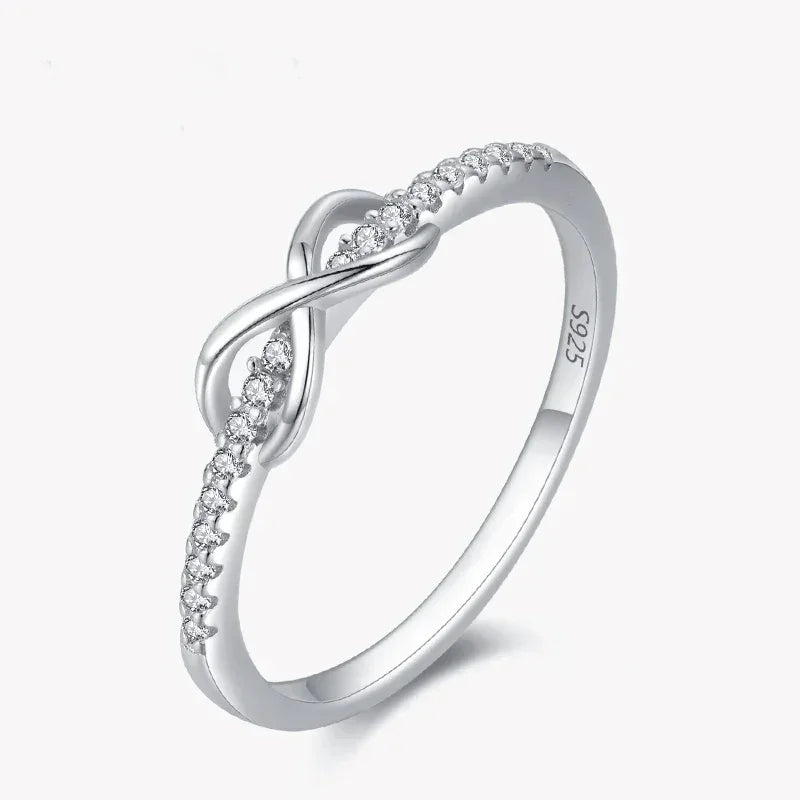 925 sterling silver infinity ring with cubic zirconia accents on white background