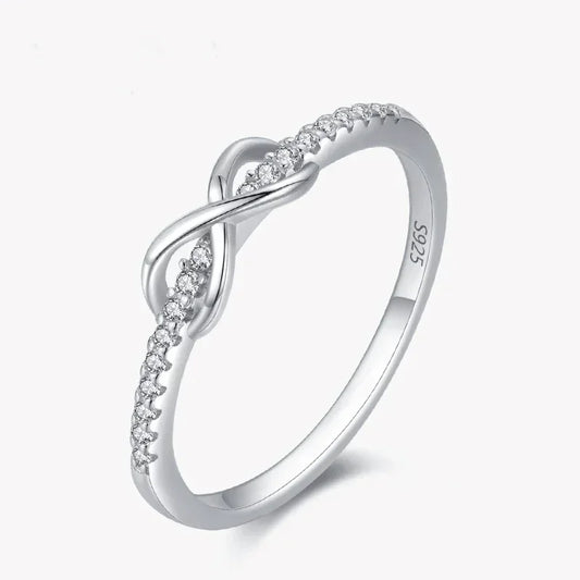 925 sterling silver infinity ring with cubic zirconia accents on white background