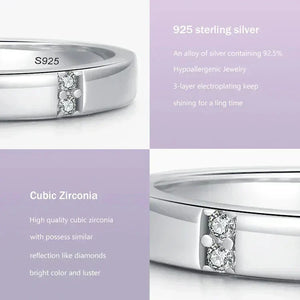 925 sterling silver ring with cubic zirconia stones, detailed close-up on polished band.