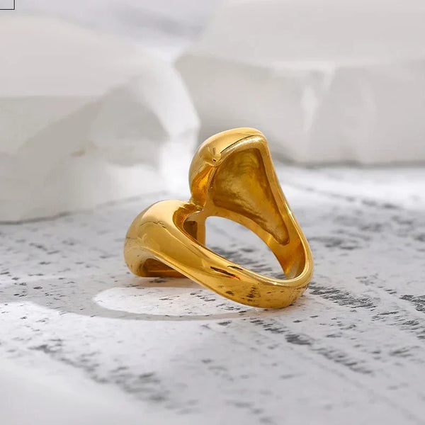 18K gold-plated sculptural open ring for women on white stone background