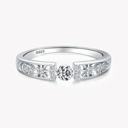 925 silver ring with central round diamond and side accent stones on filigree band