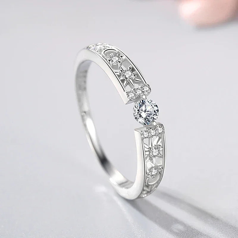 Sterling silver ring with intricate filigree and sparkling cubic zirconia stones