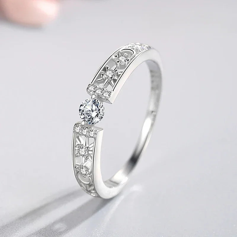 925 silver ring with intricate patterns and sparkling round-cut cubic zirconia stones