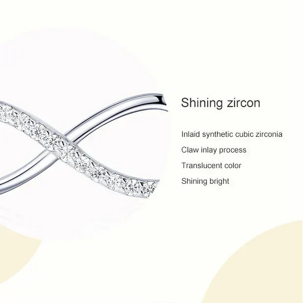 Infinite symbol necklace with zirconia stones on a white background