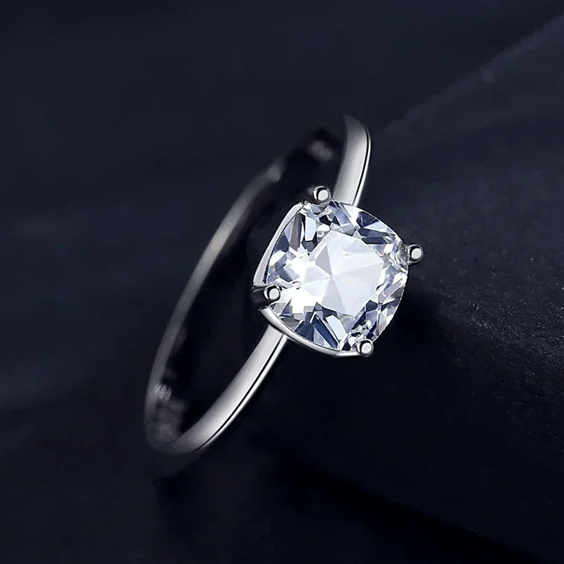 925 silver ring with cushion-cut clear gemstone solitaire on dark background