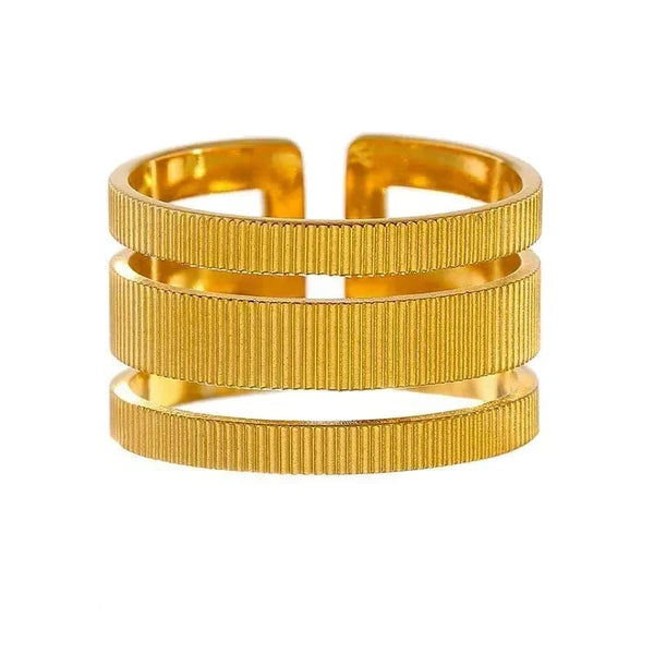 Gold bracelet with a ribbed texture on a white background