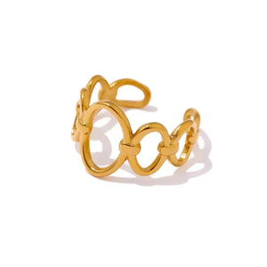 Gold ring with interlocking circular design on a white background