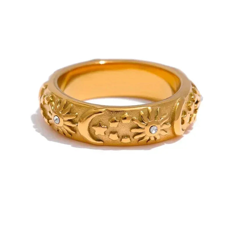 18K gold-plated ring with engraved sun, moon, and star motifs, accented with small crystals
