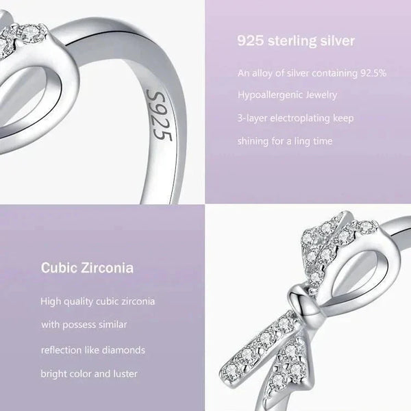 925 sterling silver ring with cubic zirconia bow detail on a gradient purple background