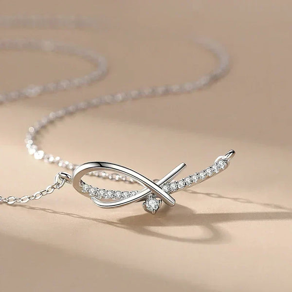 Silver necklace with a delicate design on a beige background-Sleek Geometry Pendant - TM & Co. Jewels.