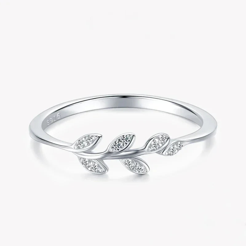 925 silver leaf design ring with sparkling stones on white background