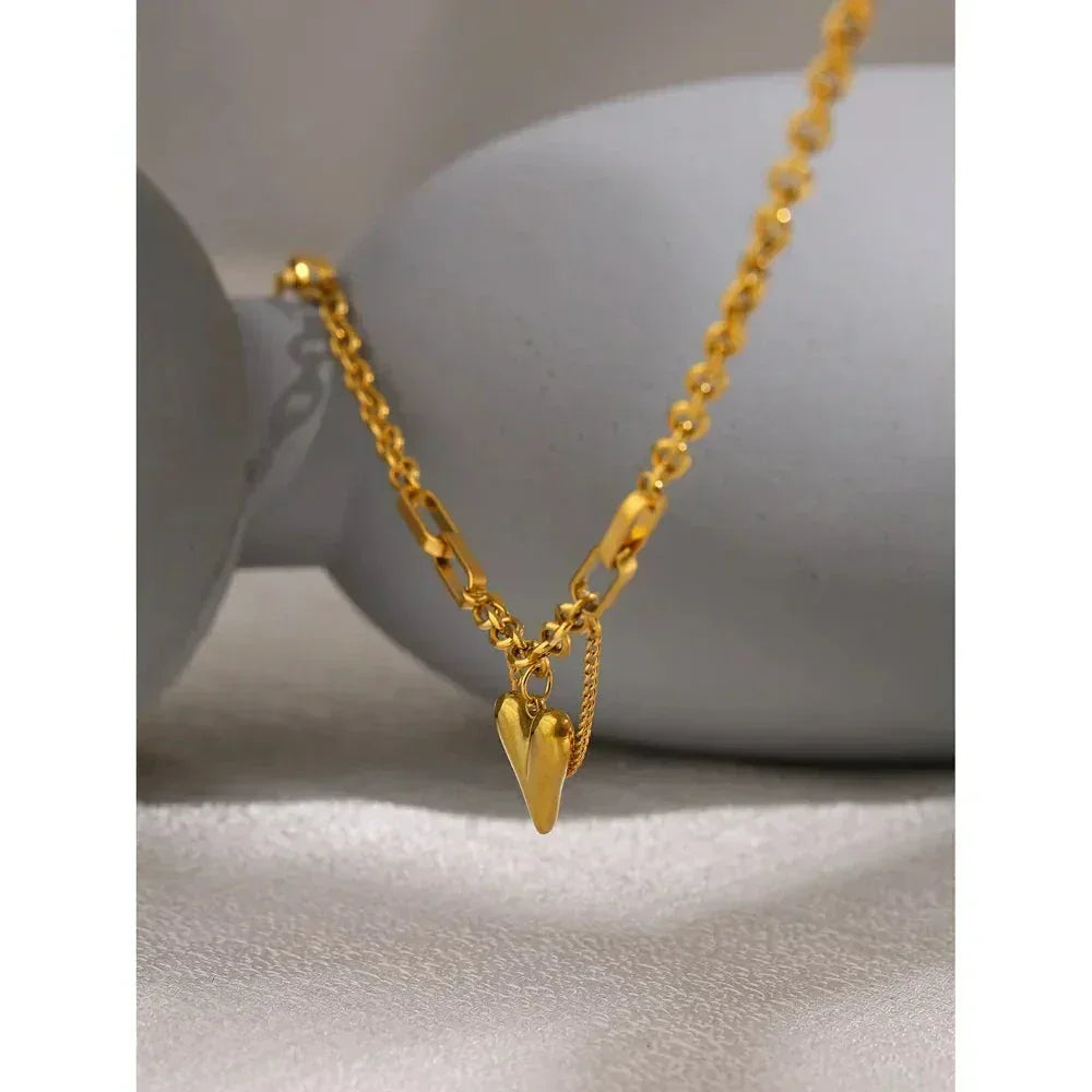18K gold-plated heart pendant necklace with textured chain on neutral background