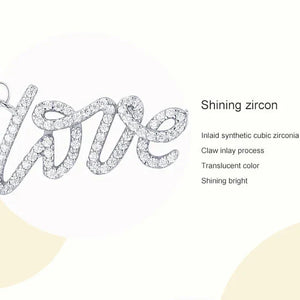 Silver necklace with 'love' pendant on a white background.