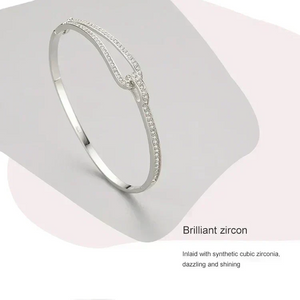 Crystal Maze Sterling Bracelet - TM & CO. JEWELS Silver bracelet with zirconia stones on a light gray background.