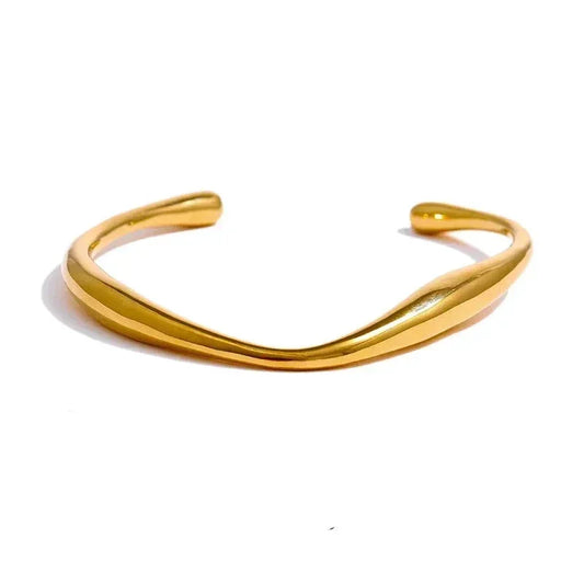 Minimalist 18K gold-plated open cuff bracelet with smooth, twisted design on white background