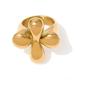 Gold ring with a unique design on a white background