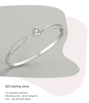 Elegant 925 sterling silver bracelet with central round gemstone and delicate pavé accents