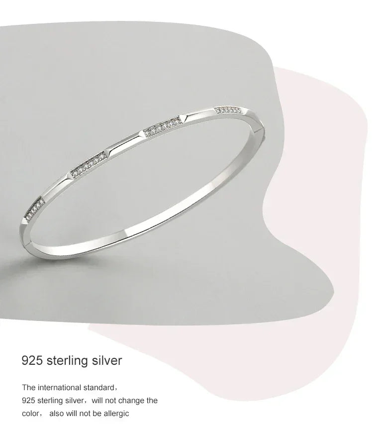 925 sterling silver bangle bracelet with geometric design and small embedded stones