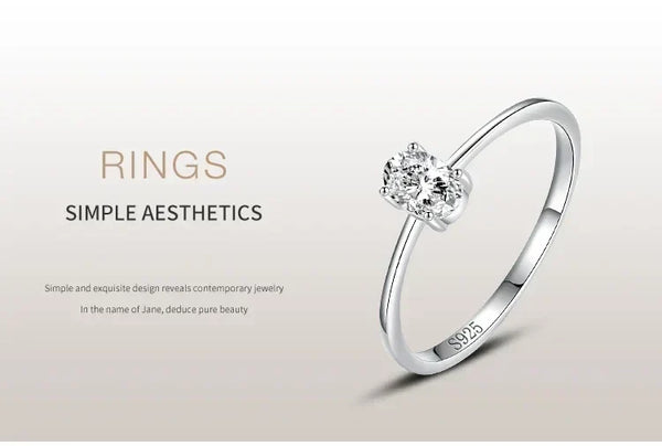 925 silver ring with single round-cut diamond, minimalist elegant jewelry on neutral background.