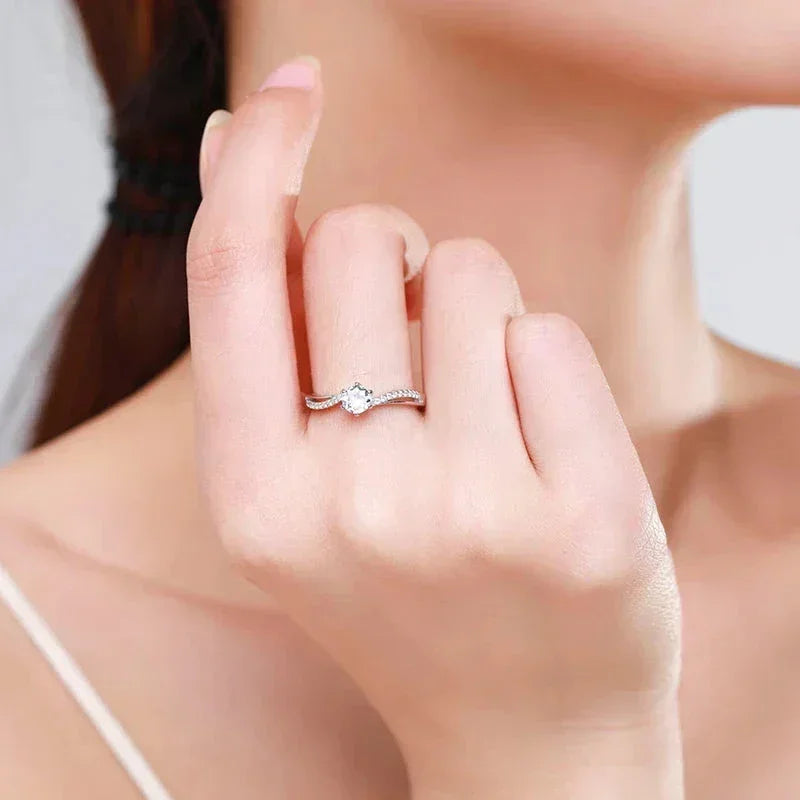 925 silver solitaire engagement ring with cubic zirconia on woman's hand