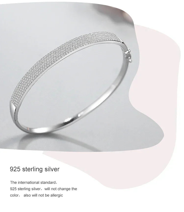 925 sterling silver bangle bracelet with pavé detailing on a light background