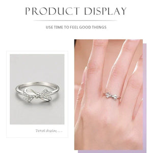 Sterling silver ring with a bow design and sparkling cubic zirconia accents