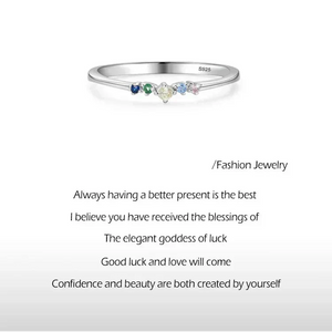 Prism Glow Stackable Ring - TM & Co. Jewels-Silver ring with multicolored gemstones on a light gray background.