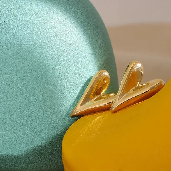 Silver and gold earrings on a teal and yellow background with 'Fashion Accessories' text.