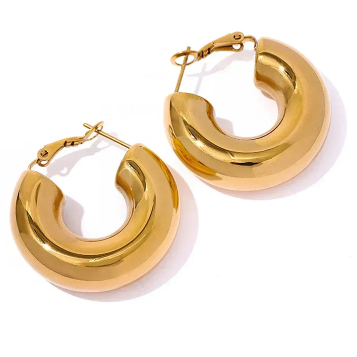 Gold hoop earrings on a white background