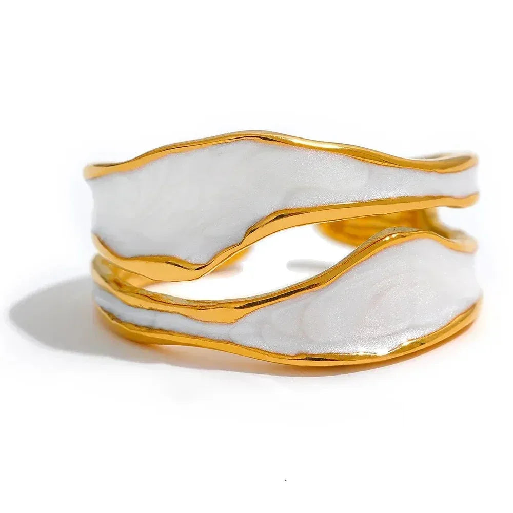 Gold-plated open band ring with white enamel, elegant handcrafted jewelry design