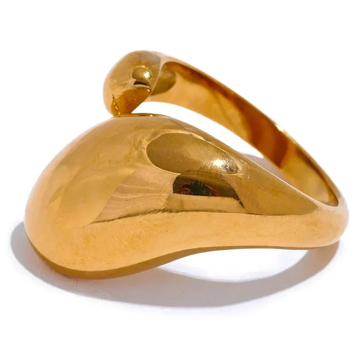 Gold ring with a unique design on a white background