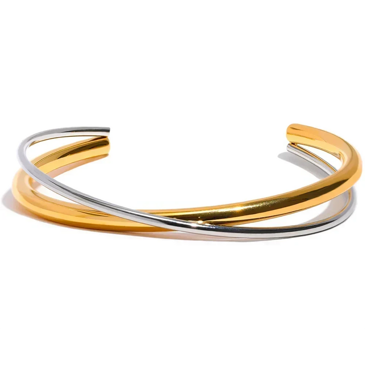 Two gold and silver bangles on a white background