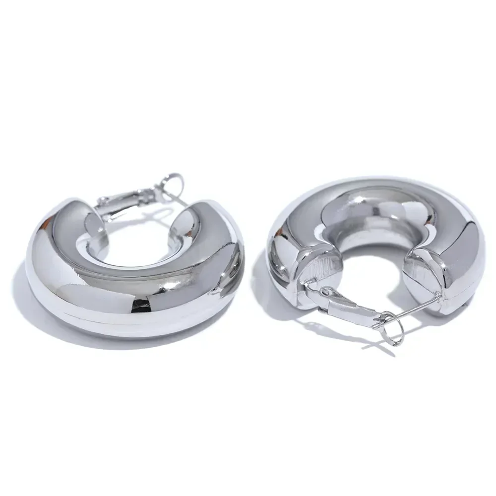 Chunky 925 silver hoop earrings with polished finish on white background
