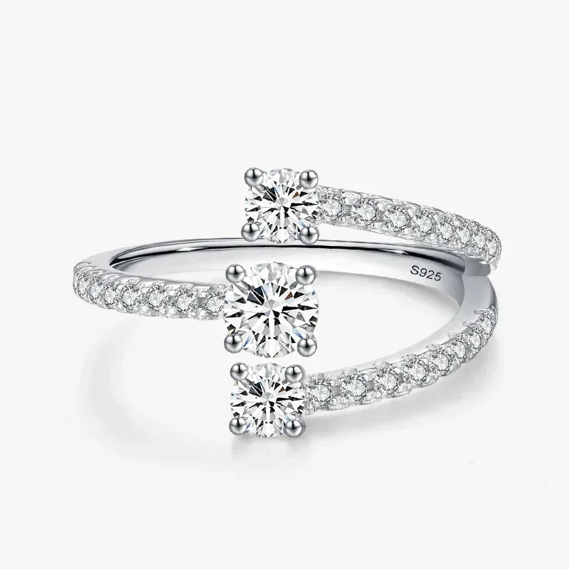 Sterling silver open ring with two round-cut cubic zirconia and pavé band accents