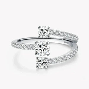 Sterling silver open ring with two round-cut cubic zirconia and pavé band accents