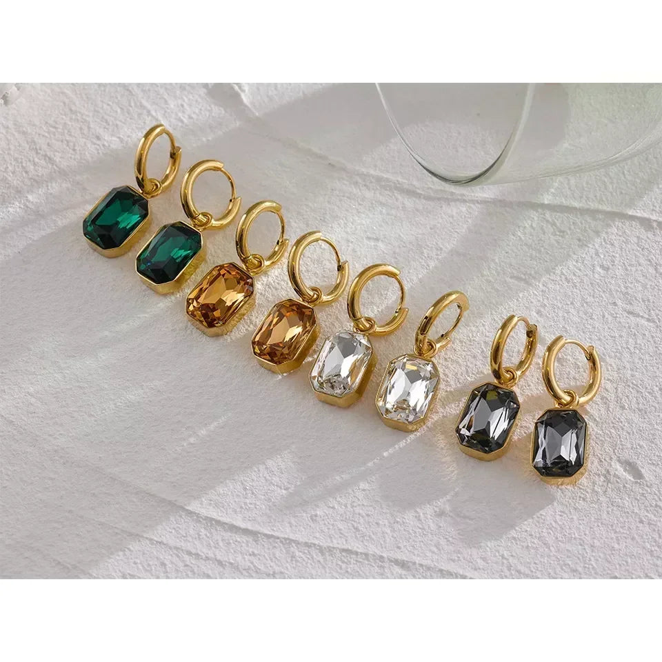 Gold-plated hoop earrings with emerald, amber, clear, and black rectangular gemstones